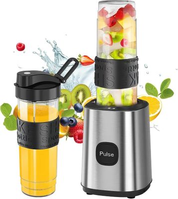 a close up of a blender filled with fruit and vegetables