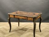 an image of a wooden table with a marble top on a wooden floor