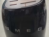 a black toaster that is sitting on a counter