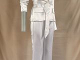 an image of a white suit on a mannequin stand