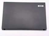 a laptop that is sitting on a white surface
