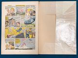 a comic book opened to reveal a page of comics