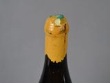 a close up of a bottle of wine on a table