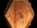 an image of a wooden wall clock on a black background