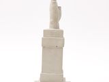 sculpture of a hand holding a finger on a pedestal