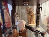 a glass display case with a lot of items in it