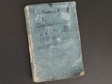 an old book sitting on top of a table with writing on it