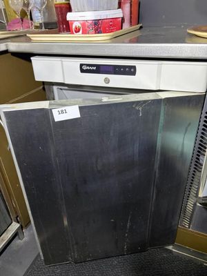 an image of a dishwasher that is in a kitchen