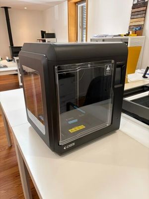 a black microwave sitting on a counter in a kitchen
