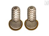 pair of silver colored metal knobs on a white background