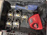 many tools in a tool box that are sitting on the floor