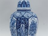 an image of a blue and white vase with a bird on it