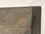 a close up of a book with a picture of a man on it