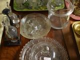 a table with a lot of glass dishes and dishes on it