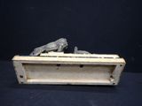an old wooden box with a statue of a cat on top of it