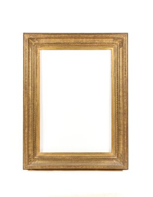 a gold frame on a white wall with a white background
