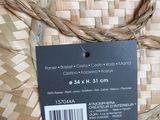 a label on a wicker basket with a tag on it