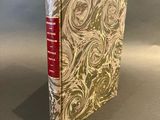 a close up of a book sitting on top of a table