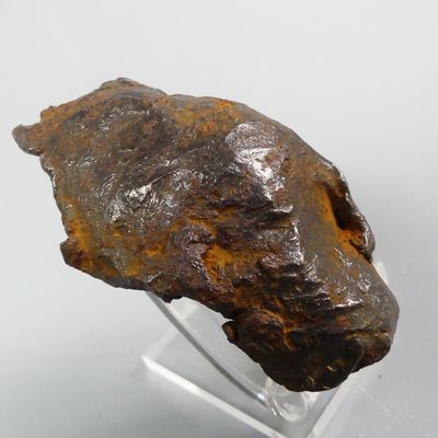 an image of a piece of rock on a clear stand