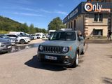 a jeep parked in front of a building in a parking lot