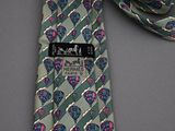 a green tie with a pink and blue design on it