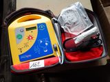 a yellow and blue aeg machine in a red case