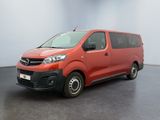 the red van is parked in the empty room of the building