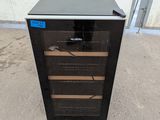 an image of a wine cooler sitting outside of a building
