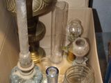 a box full of glass jars and a lamp in it