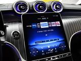 the dashboard of a car with a tablet on the dashboard