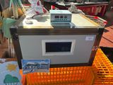 a machine that is sitting on top of an orange crate