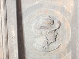 a statue of a woman with a bird on it ' s head