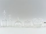 a lot of glass bottles that are sitting on a table
