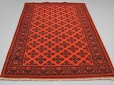 an orange and black rug on a white background