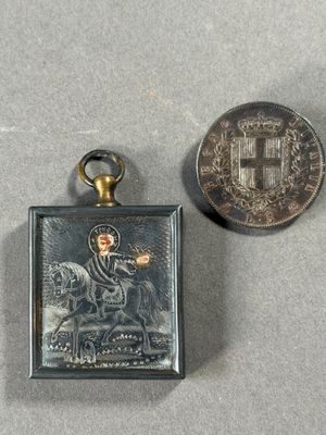 a small silver medal and a small silver medal