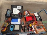 a cart full of electronic equipment sitting on the street