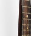 a close up of a mandolin that is sitting on a table
