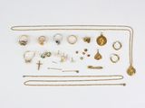 a close up of a bunch of jewelry on a white surface