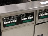 a picture of a commercial fryer that is in a kitchen