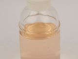 a small glass bottle with a liquid inside of it