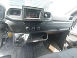 the interior of a car with a steering control and dashboard controls