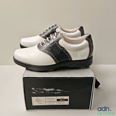 a pair of shoes that are on top of a box