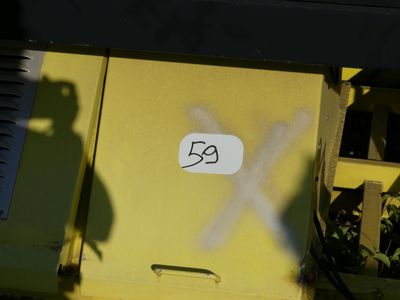 a sign on the side of a yellow train