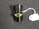 a ring that is sitting on a table with a price tag
