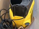 a box with a yellow and black machine inside of it