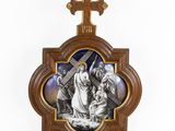 a wooden cross with a picture of jesus on it