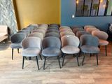 a lot of chairs that are lined up in a room
