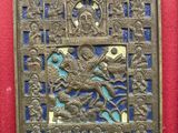 an image of a metal plaque with a picture of a man on a horse
