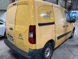 a yellow van that is parked in a garage