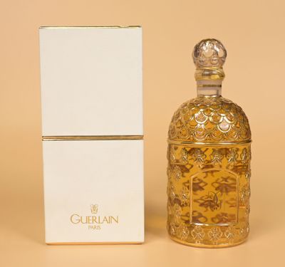 perfume bottle and box of perfume on a beige background